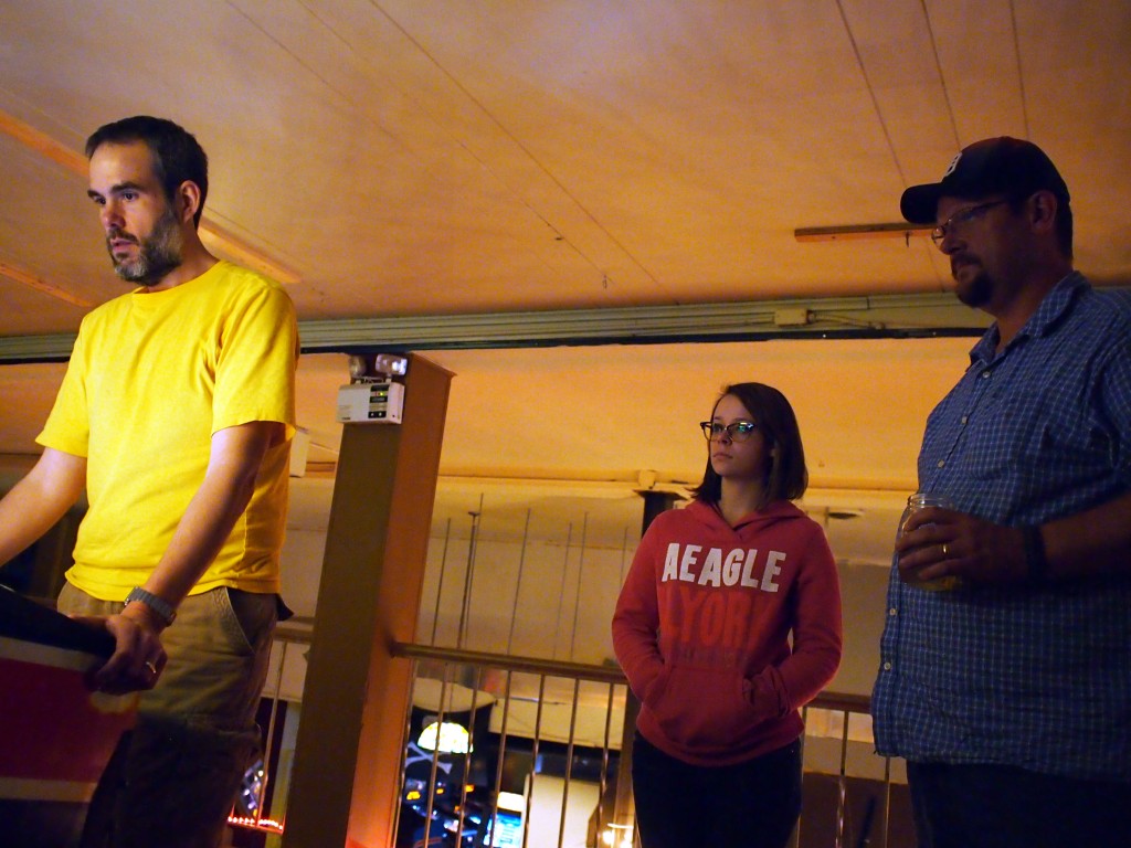 Joseph says this is a picture of him getting some bad news about his taxes.  Actually he's playing Austin Powers while Samantha and Mark watch.