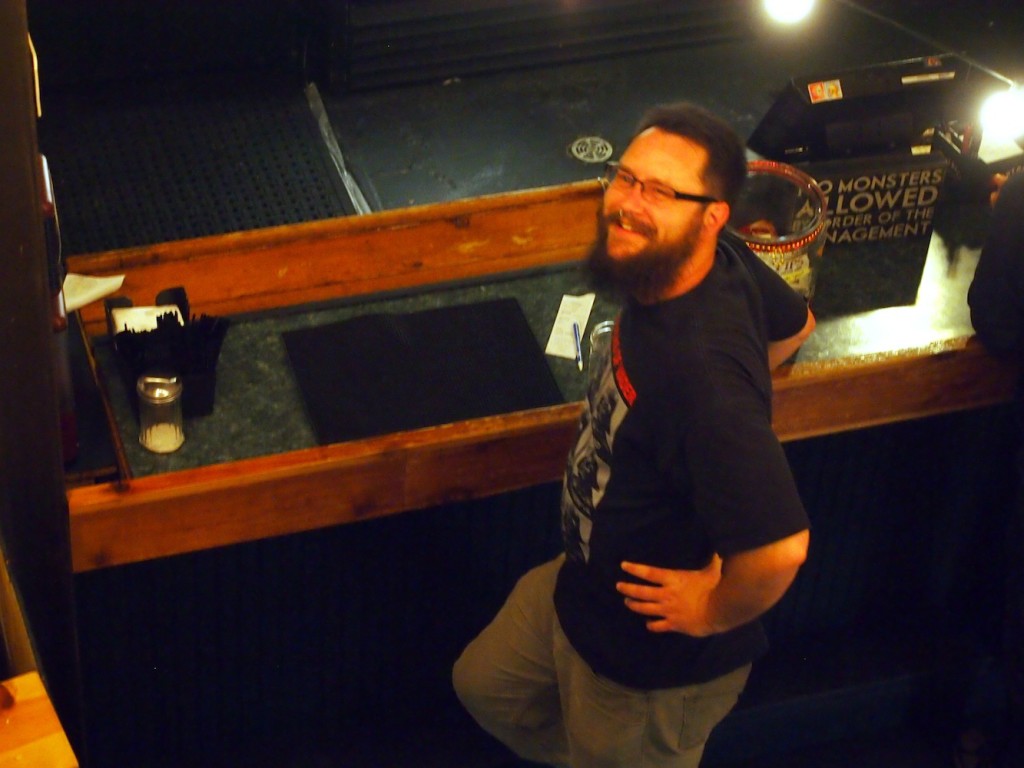 Matt gets a beer at the bar.