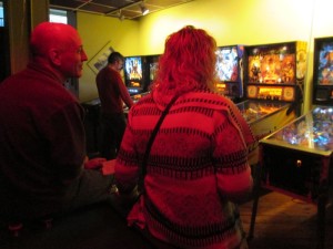 Chris warms up for league by standing under the heat lamp.