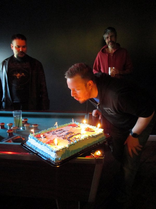 Mike blows out the candles