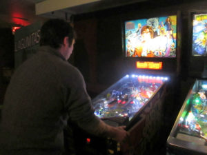 Russell endures a game of Austin Powers.