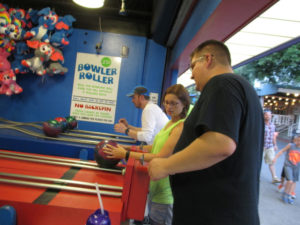 Mike, Christine, and Jake playing the Bowler Roller game.