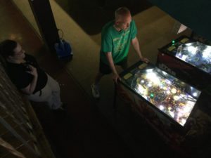 Kristen watches Chris play Iron Maiden.