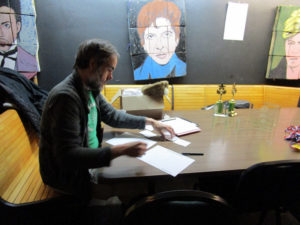 Joseph gets the brackets ready.