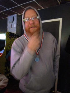 Derik stroking his beard.