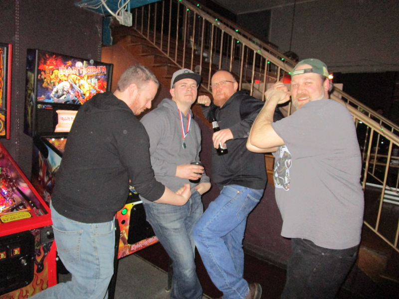 The four finalists pretend to fight.