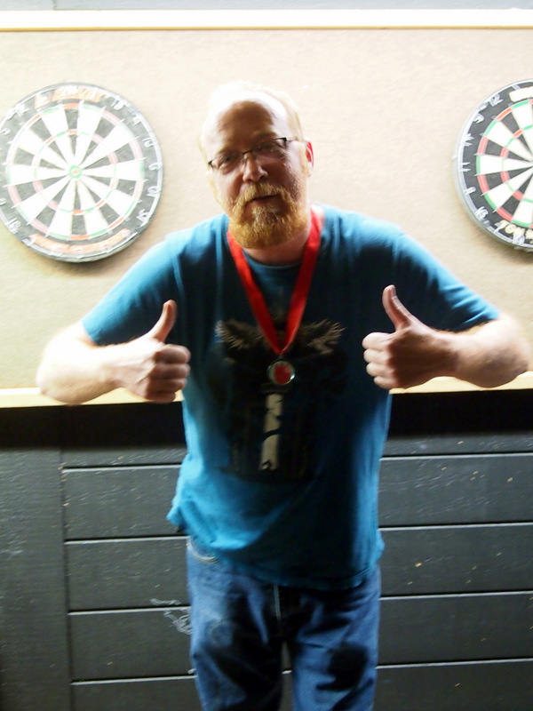 Derik giving thumbs up and wearing his medal.