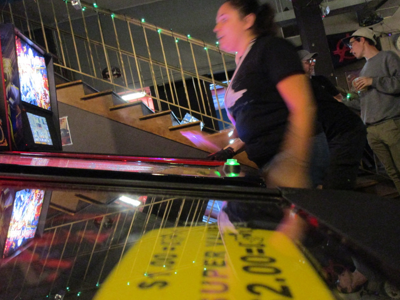 Lupe motion-blurred, apparently having just finished a ball on Kiss.