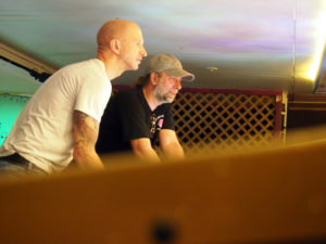 Josh and Pat playing split flipper, with Pat on the left and Josh on the right.