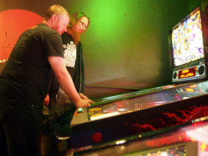 Mike and Bryan playing split flipper with Bryan on the left and Mike on the right.