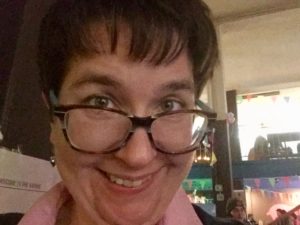 Heather with a goofy grin at the camera.